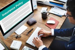 A man reviews his policy before making a homeowners insurance claim